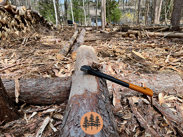 split-rail-fence-construction-removing-bark-with-a-hatchet